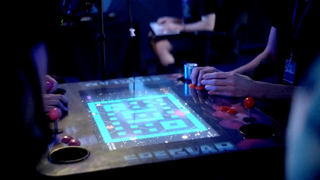Two people playing the Speglar arcade cabinet in an e-sports venue